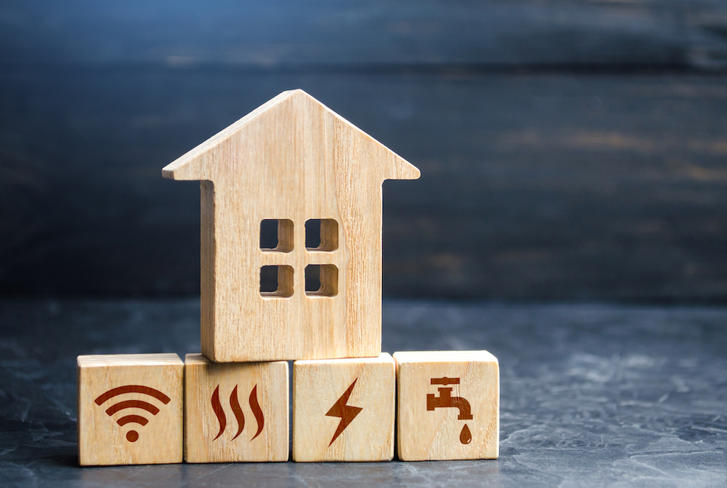 Wooden house on top of blocks representing everything that goes out without backup generator repair.