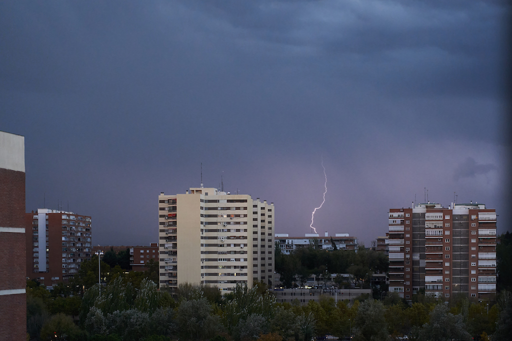 Stormy weather over downtown and commercial buildings. Commercial Generator Service.