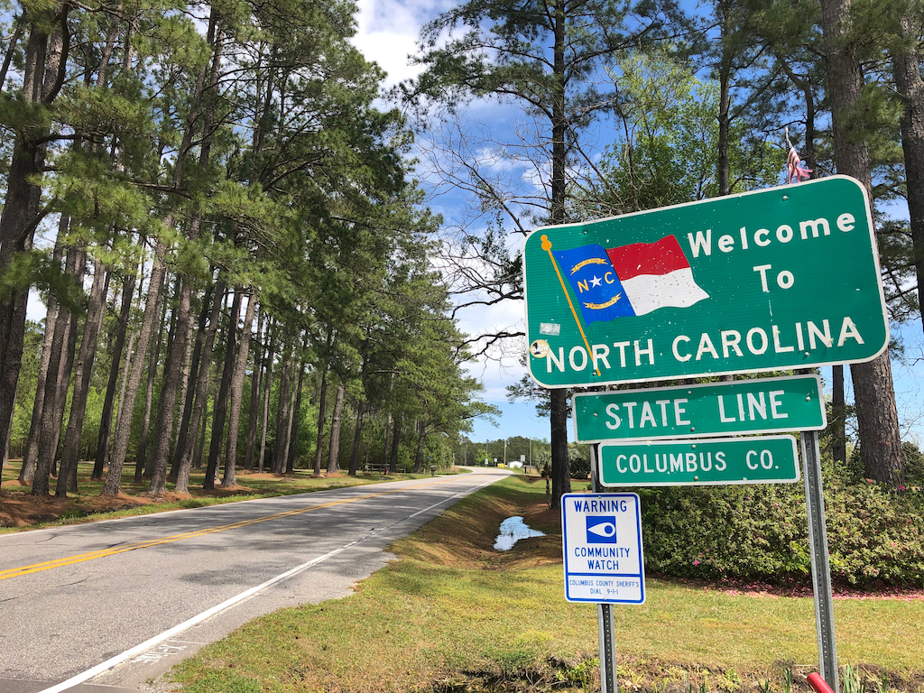 Welcome to North Carolina sign. Generator services.